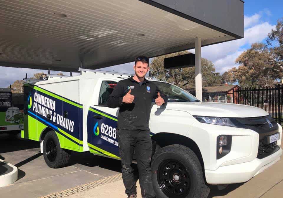 Plumber with truck at Canberra Plumbing & Drains.