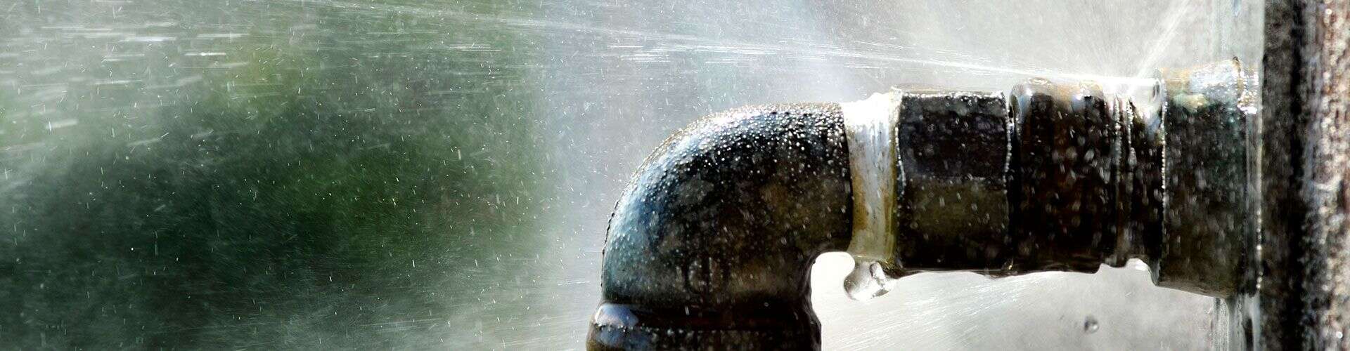 Leaking pipe causing water damage in Canberra plumbing emergency.