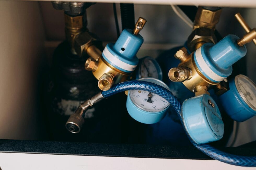 Gas heater service components with gauges and valves in Canberra.